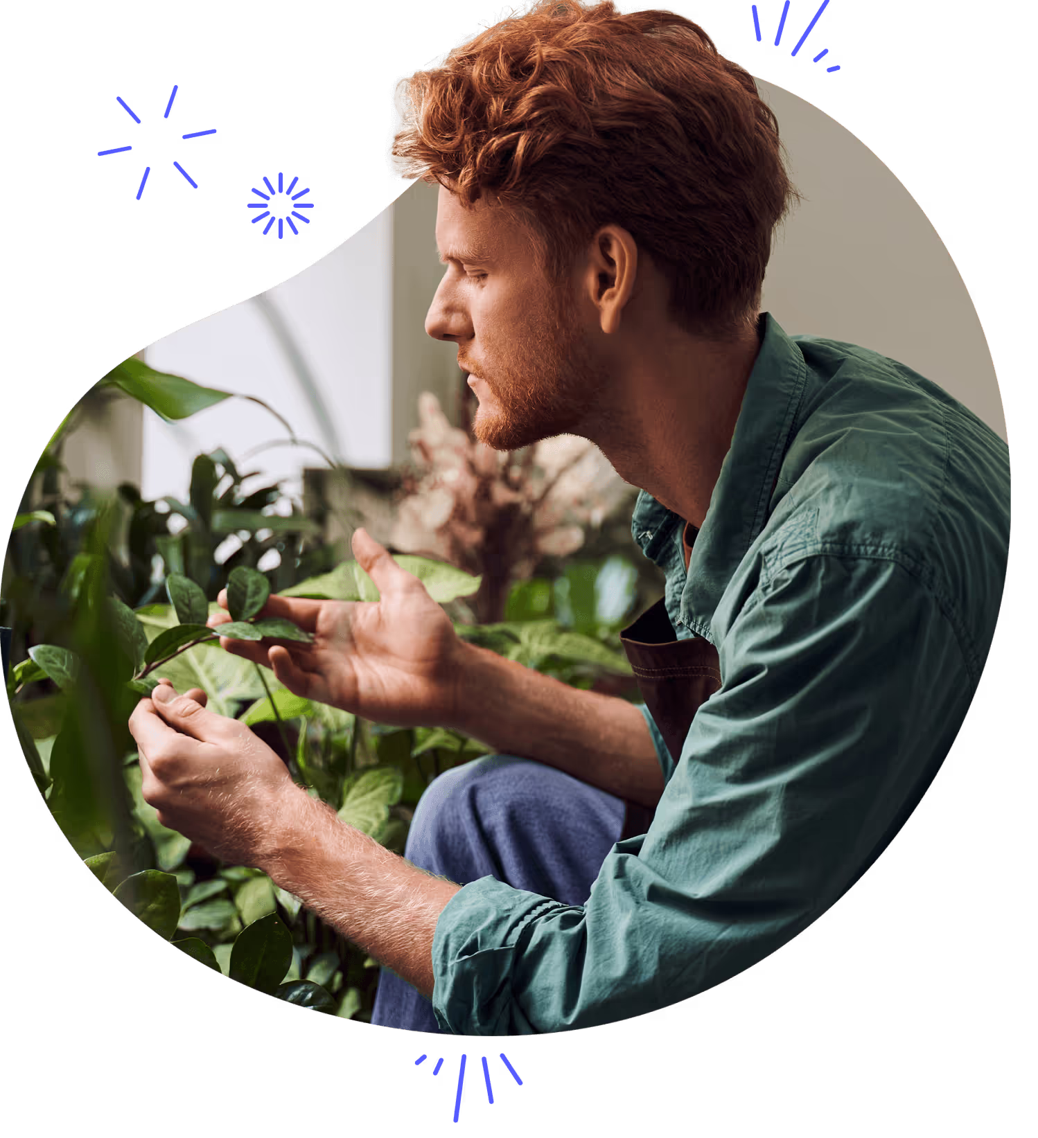 A man with red hair outside gardening
